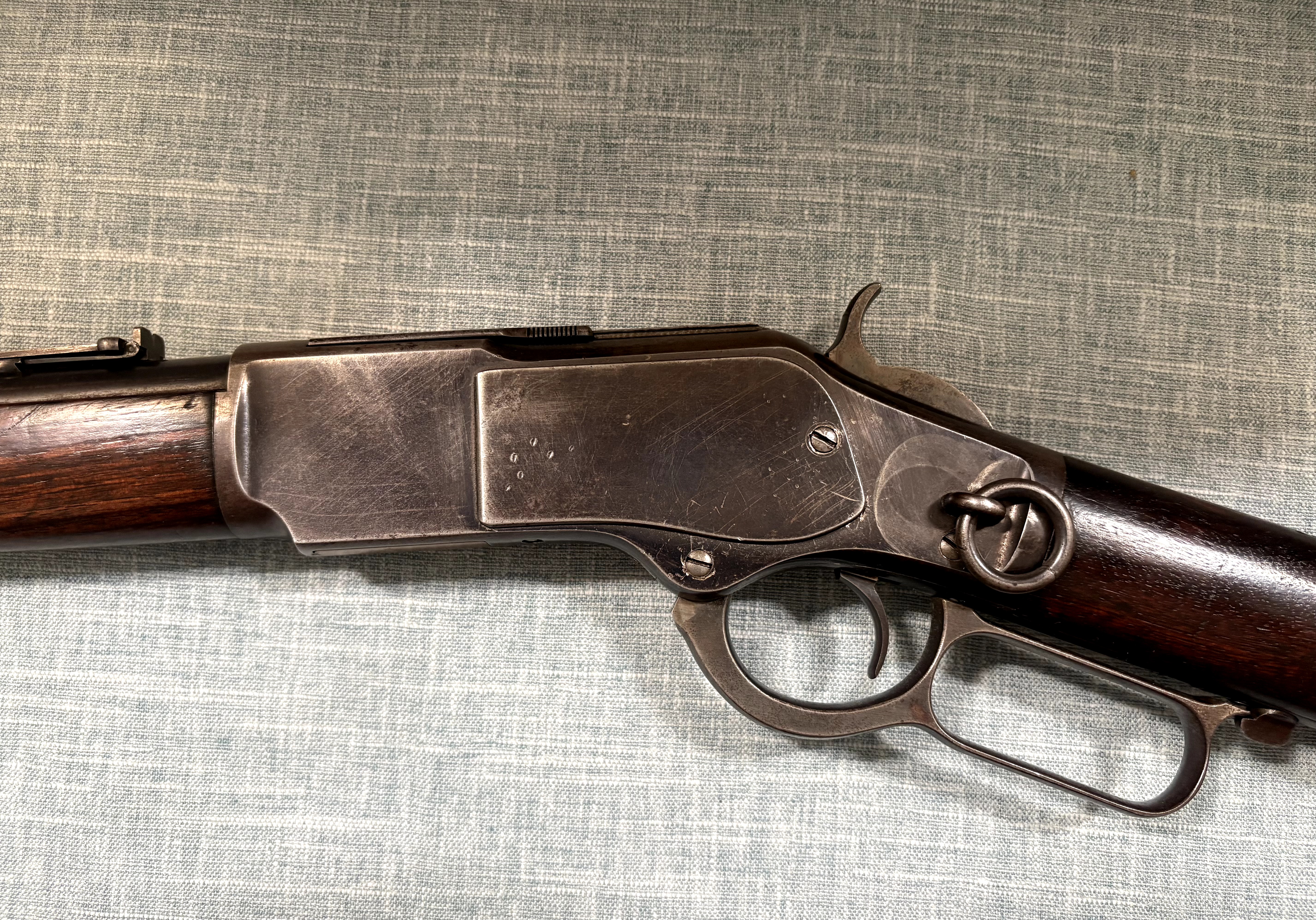Winchester Model 1873 left-side receiver, saddle ring, hammer, trigger, and lever