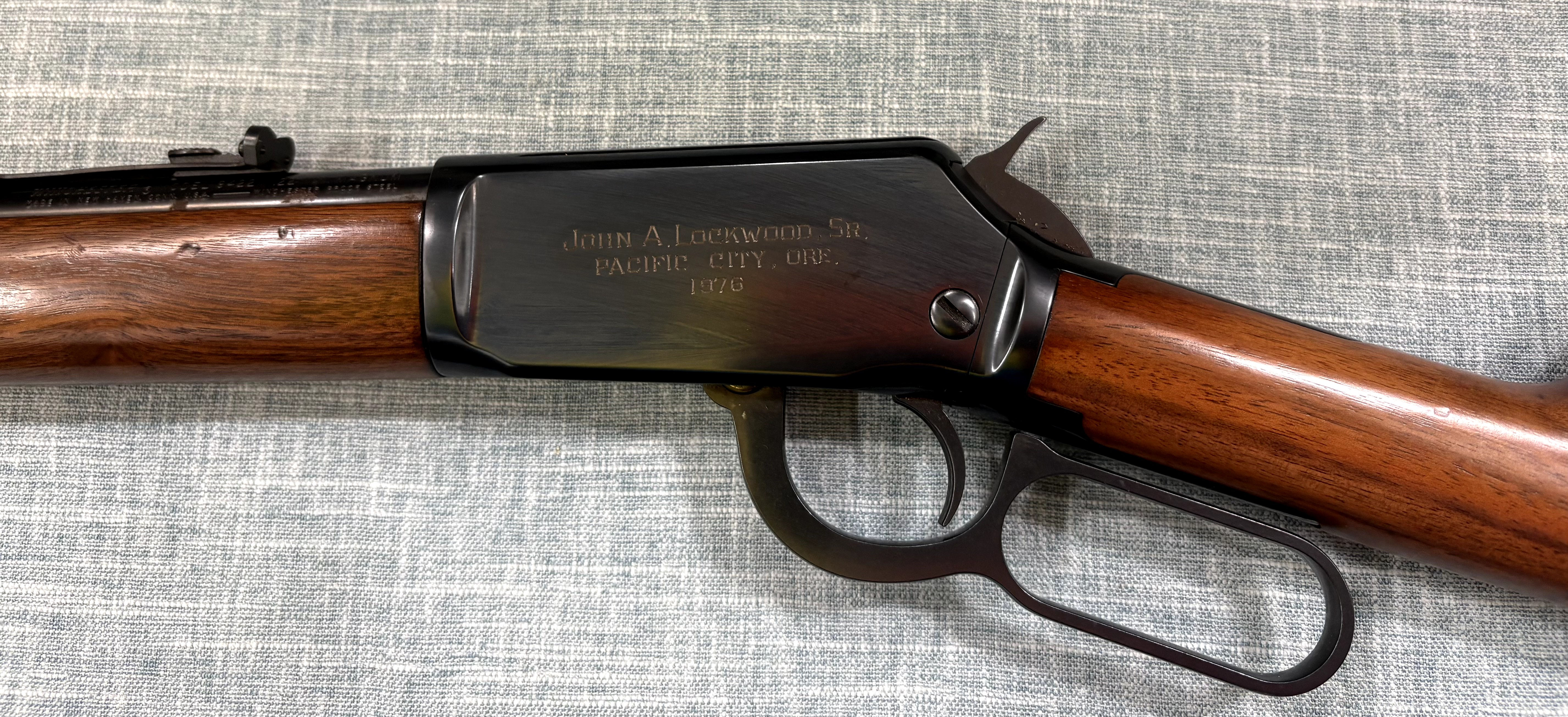 Winchester Model 9422M inscribed left-side receiver, hammer, trigger guard, and lever